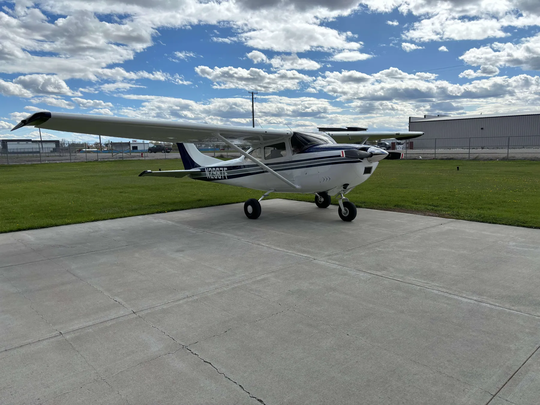 N2987F, a blue and white 1966 Cessna 182J, viewed from the front left